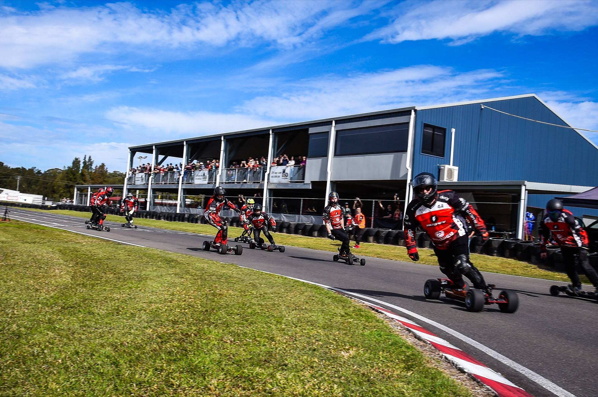 eSkate riders leaning through the first corner at the 2026 AUS PEV Nationals